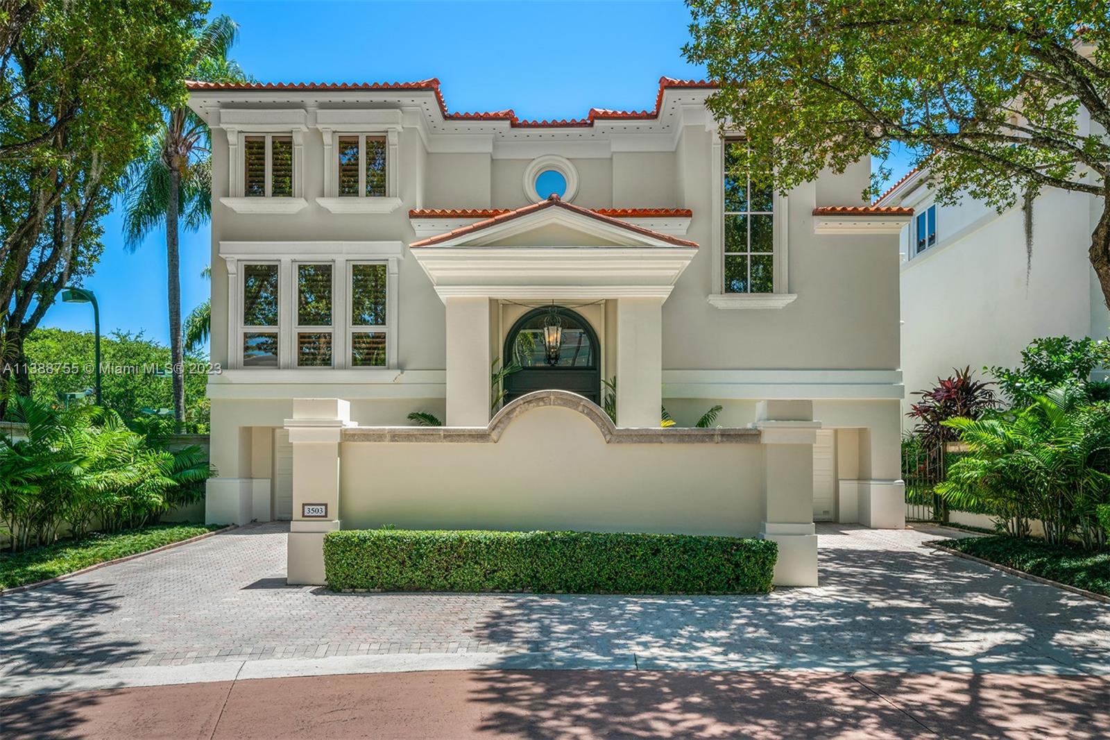 Lushly landscaped Palm Beach style 7,201 Sq Ft 3-story home with 4-BD and 5.5-BA in Coconut Grove’s gated “Bayshore Villas” waterfront enclave of 25 single family luxury homes. Features reflect the epitome of elegance and good taste, with exquisite interior millwork detail, grand entry with volume ceilings and double-height main door, elevator, and multiple covered terraces. An expansive floor plan includes a formal living room, bar area with bamboo-textured ceilings, 2 family rooms, 2 laundry rooms, spacious primary bedroom suite, elegant dining room, and gourmet eat-in kitchen with custom cabinetry, large island and top-of-the-line appliances. Minutes from some of the best parks, schools, marinas, and restaurants in Miami. Amenities include a clubhouse, pool, and two tennis courts.