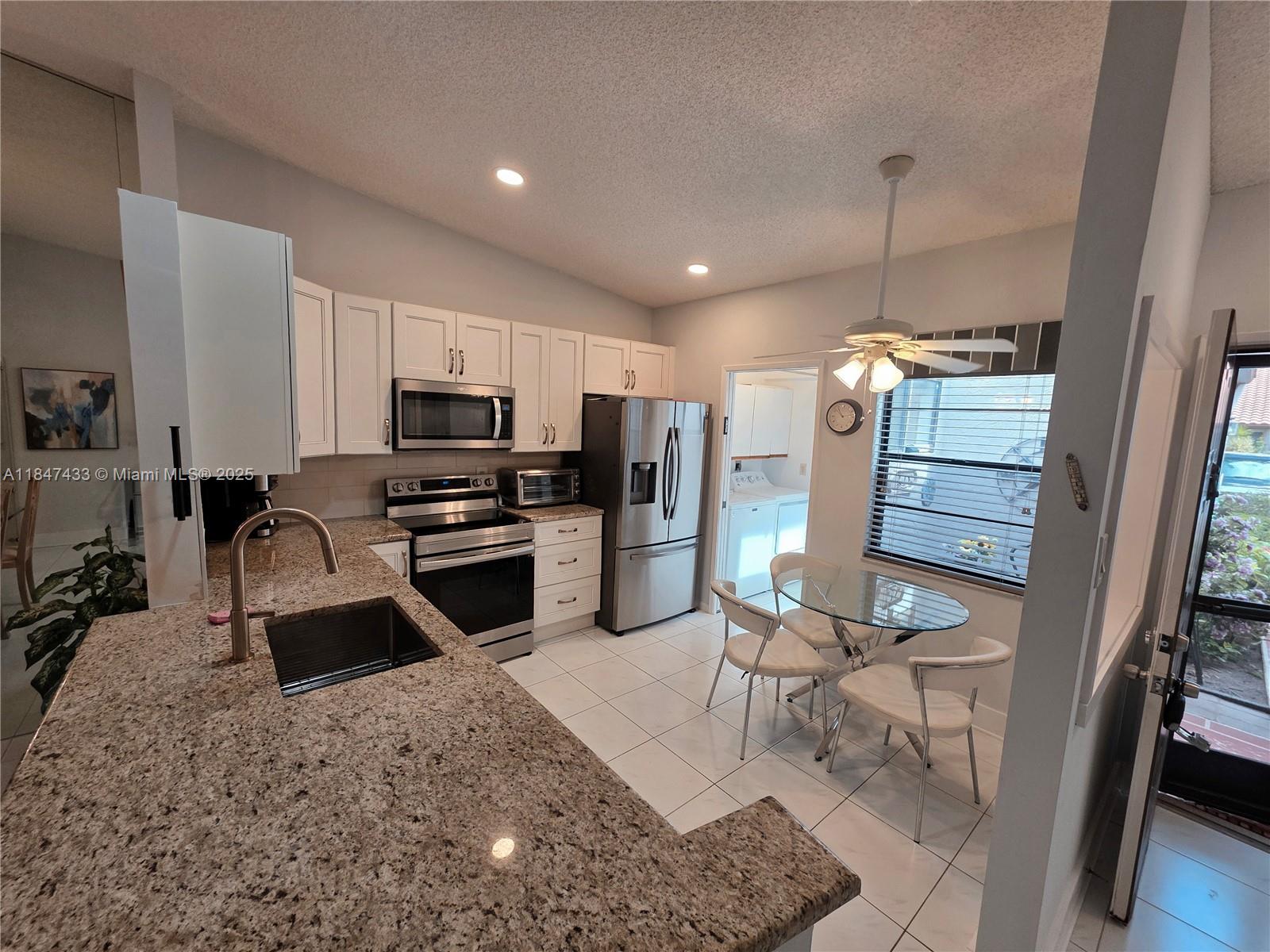 Welcome to 6220 Kings Gate Circle, located in the highly desirable 55+ community of Huntington Pointe in Delray Beach. This bright and spacious 2-bedroom, 2-bathroom villa features a 1-car garage, an updated kitchen with modern finishes, and a renovated master bathroom. Enjoy the natural light that fills the home and relax year-round in the enclosed patio, perfect for additional living space or a quiet retreat. Huntington Pointe offers resort-style amenities including a clubhouse, indoor and outdoor pools, tennis, pickleball, fitness center, and organized activities. Ideally situated just minutes from shops, restaurants, and the beach, this is Florida living at its finest!