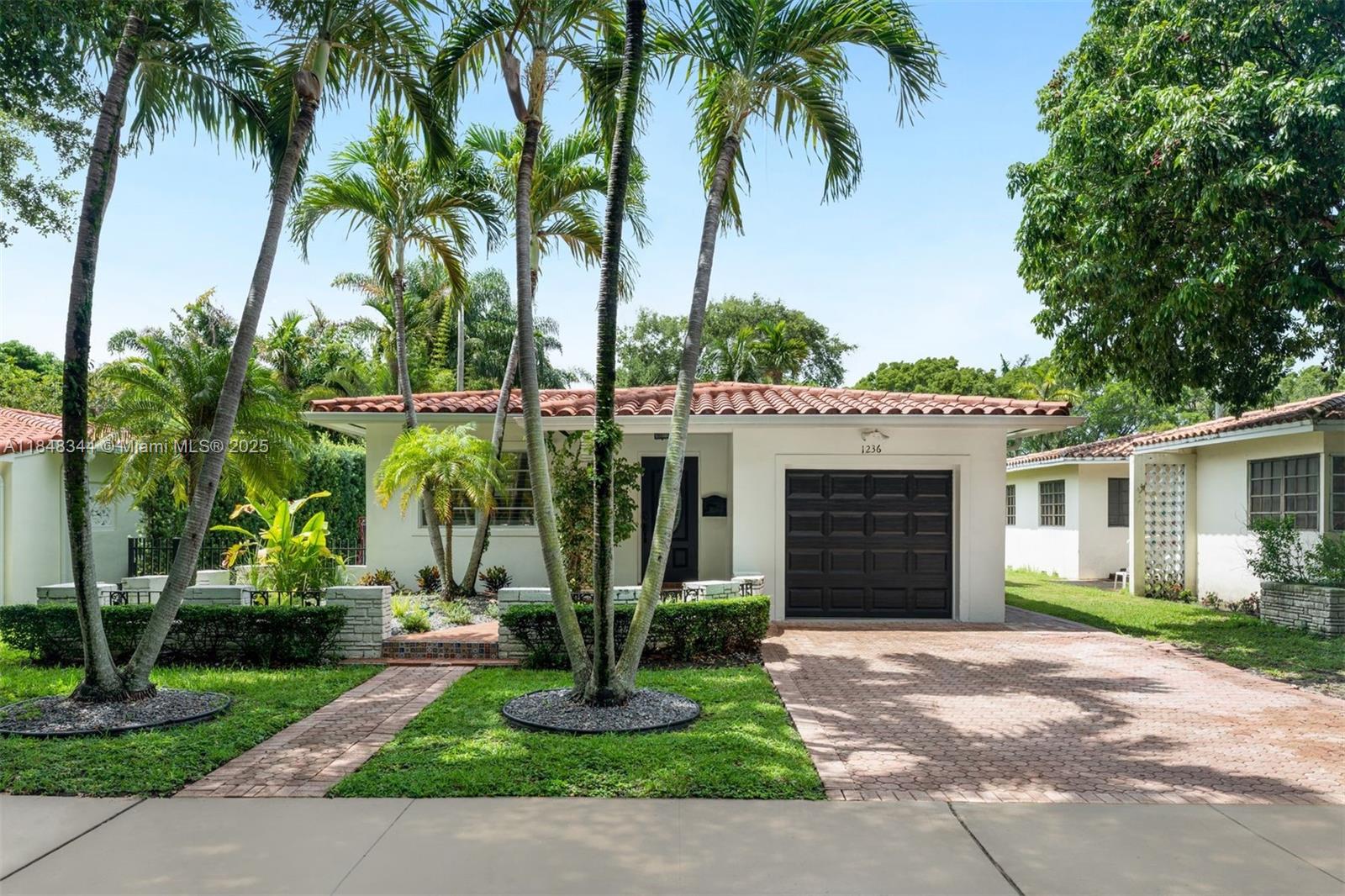 The epitome of Coral Gables charm! Welcome to this fully turnkey 3BD/2BA home centrally located on a quiet, beautiful tree-lined street! This home was renovated from top to bottom in 2021 while tastefully preserving some of its historic features such as the original Dade-County pine floors. The layout was thoughtfully curated to maximize space with its open floorplan featuring over 1,750 interior SF. The show-stopping kitchen features quartz countertops, a large island, wine fridge, wall oven + electric cooktop w/ a range hood, & plenty of cabinet space. Additional updates: PVC plumbing, 2018 AC & water heater, recessed lighting, renovated bathrooms, covered patio w/ bistro lights, & a 1-car garage w/ additional overhead storage. Home is on public sewer! By appointment only.