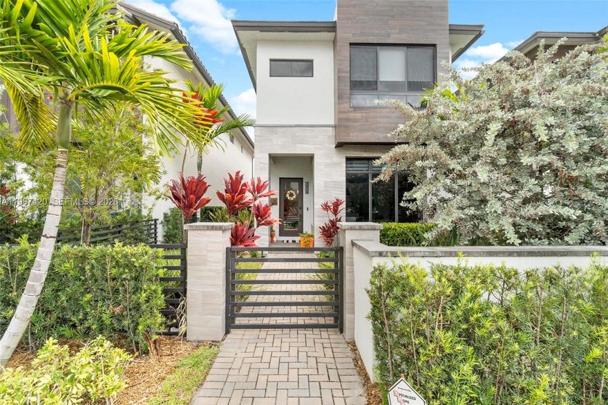 Modern home located in Downtown Doral featuring 4 bedrooms, each with its own private bathroom, plus a half bath on the first floor.

Open-concept layout with high ceilings, porcelain tile floors, and impact windows and doors. Kitchen includes quartz countertops, custom cabinetry, center island, and stainless steel appliances.

Living areas connect to a private patio through sliding glass doors. Primary bedroom includes dual sinks, soaking tub, and separate shower.

Two-car garage plus one uncovered parking space next to the garage, as well as additional parking available in front of the property.

Located near dining, shopping, and major highways.