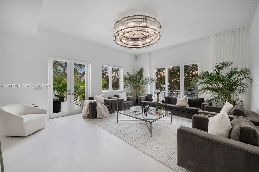 This 4,584 SF home offers five en suite bedrooms and expansive indoor outdoor living with nearly 7,000 SF of usable space, featuring wide water sunset views, a deeded private dock, private elevator, and two car garage, just one block from the beach and a short golf cart ride to La Gorce Country Club.The residence features high ceilings and interiors that capture sunset and skyline views, with RH Luxe décor available, an oversized RH chandelier, media lounge, formal waterfront dining, and five en suite bedrooms, each with private outdoor space.Finishes include limestone floors, Carrara marble, and quartz surfaces. The great room flows into a chef’s kitchen with waterfall island, Thermador and Sub Zero appliances, induction cooking, and natural gas. Multiple terraces create true outdoor living ideal for entertaining, yoga, barbecues, gardening, or a private gym. Enjoy no fixed bridge boating from your private dock, or take your golf cart to the beach or La Gorce Country Club.Aqua at Allison Island offers two resort style pools, a full service spa, 6,000 SF fitness center, concierge services, and a waterfront boardwalk minutes from Bal Harbour Shops, South of Fifth, Downtown Miami, and the Design District. The Green House is one of only a handful of true trophy residences within Aqua that remain.