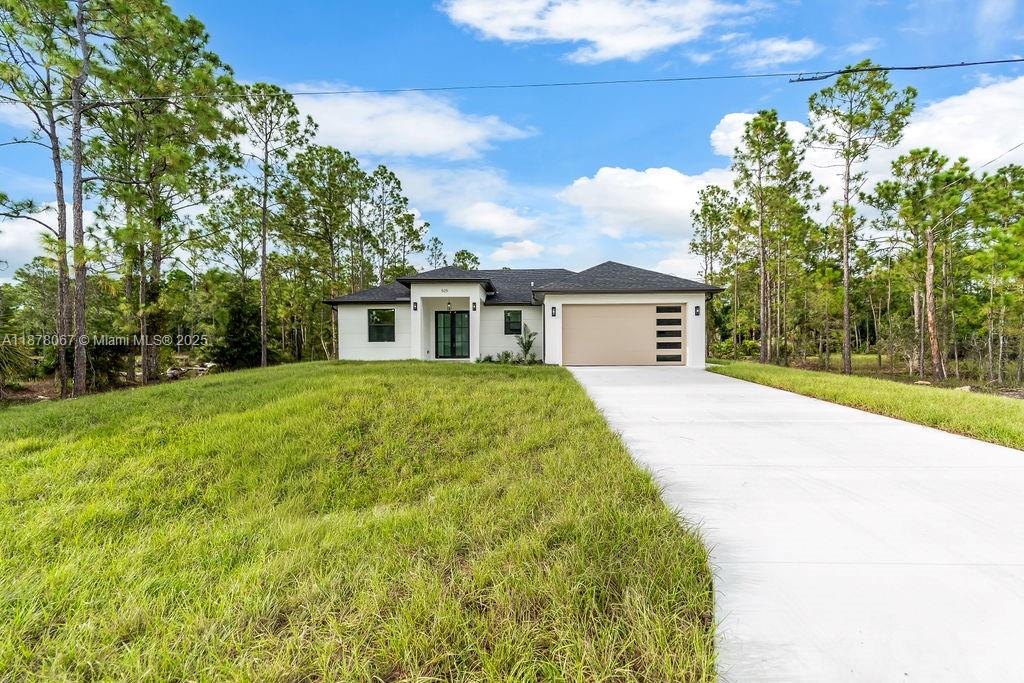 Seller is Offering CLOSING COST ASSISTANCE, making this MOVE-IN READY home an incredible opportunity. NEW CONSTRUCTION 3 BED, 2 BATH home built in 2025. Designed with every detail in mind, it features an OPEN FLOOR PLAN with soaring HIGH CEILINGS and PORCELAIN TILE FLOORING throughout. The TWO-TONE KITCHEN offers QUARTZ COUNTERTOPS, FULL QUARTZ BACKSPLASH, STAINLESS STEEL APPLIANCES, plus WASHER & DRYER. The PRIMARY SUITE includes a DOUBLE SINK VANITY, LED MIRROR, and STYLISH SHOWER. Built with the highest standards, this home offers IMPACT WINDOWS & DOORS, a TWO-CAR GARAGE, and elegant finishes. Outdoors, relax on the LANAI and OPEN PATIO with serene canal views. Located in a QUIET NEIGHBORHOOD, just 2 minutes from SR-82, 25–35 minutes to Fort Myers Beach, and about an hour to Naples.