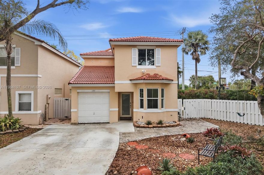 Beautifully fully renovated 2-story single-family home on an oversized corner lot in the gated community The Park at Rock Creek in Cooper City. This property features 3 bedrooms and 3 full bathrooms, plus a garage converted into an additional room/flex space, offering ample space and comfort for any family. Stunning open kitchen with granite countertops and stainless steel appliances. Modern updated bathrooms. Tile flooring throughout both levels, ensuring a cohesive and stylish aesthetic. For added convenience, one bedroom and a full bathroom are on the first floor, while the laundry area, complete with newer washer and dryer, is located on the second floor. Outside you'll discover a large, fully fenced wrap-around backyard, ideal for entertainment. Upgrades include a NEW ROOF 2025, and impact windows and doors. 1-car garage converted into a bedroom, with a large driveway fits up to 6 additional cars. The community amenities includes pool and ample guest parking. Assigned to an A-rated school district. Centrally located near shopping and major highways. Mortgage savings may be available for buyers of this listing.