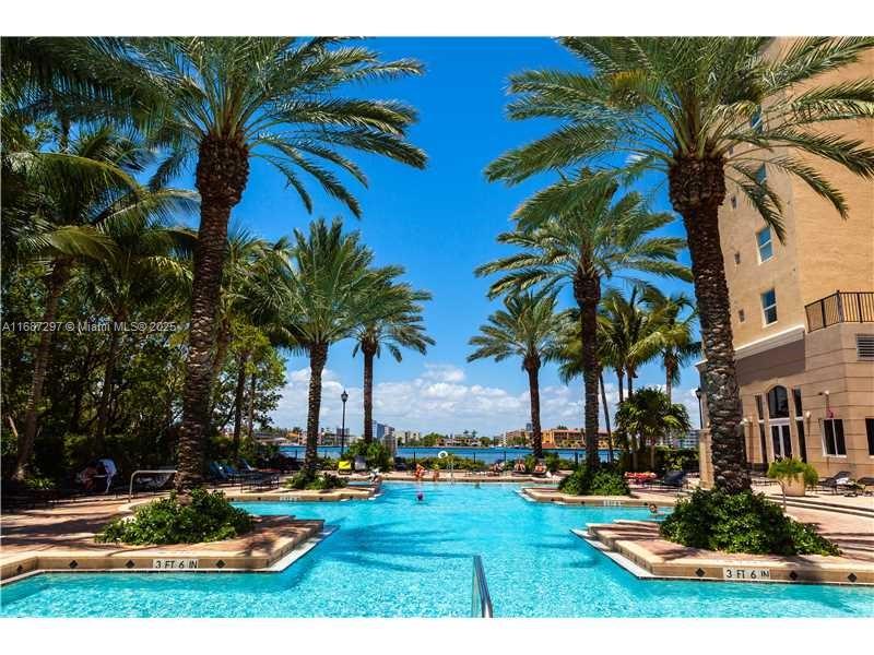2 bedroom 2 bathroom in beautiful Porto Bellagio Condominium, split floor plan with extra large walk-in closet in the master bedroom, large master bathroom with double sink and towel closet. tiles throughout the apartment. washer and dryer inside. balcony is large and faces to the garden and intracoastal. walking distance to the beach, shops, restaurants and Sunny Isles K-8 School. Building is pet friendly and offers 2 pools, jacuzzi , gym with brand new equipment, barbeque area and a promenade around the building . Easy to show