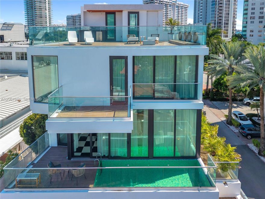 MAJOR PRICE REDUCTION OF $1,000,000 AND AGGRESSIVELY PRICED TO SELL. 
Live the venetian islands lifestyle at Villa Eva ~ a unique 5-story new modern loft-style residence w/pool & rooftop deck w/direct biscayne bay views!!! Perfectly positioned just behind the Iconic The Standard Spa. 
This 3,354 SF home features 3 ensuite bedrooms, elevator access, and open living and dining spaces designed for seamless indoor-outdoor living. The primary suite includes wet bar and kitchenette, spa-inspired bath, and terrace. Additional conveniences include a laundry, trash chute, office nook, and gated covered parking for four cars.