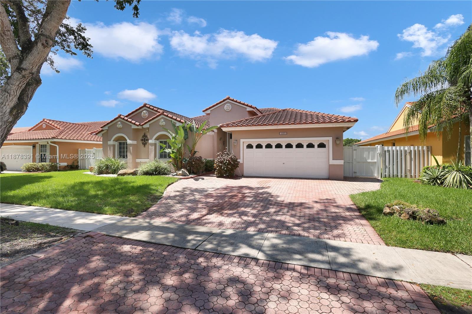Absolutely gorgeous one-story home! This 4-bedroom, 2.5-bath residence offers breathtaking lake views and a spacious open-concept layout. Roof replaced in 2019. Features include tile flooring throughout, crown molding, accordion shutters, Bahama shutters, and a brand-new roof with a high-efficiency A/C. The gourmet island kitchen boasts granite countertops, perfect for entertaining. The oversized master suite includes a luxurious bath with a Jacuzzi tub. Additional highlights: sprinkler system, garage faucet with exit door, attic access, and a fully fenced yard. Enjoy the spectacular and serene views of the magical lake right from your backyard. Chandeliers and furniture are negotiable.