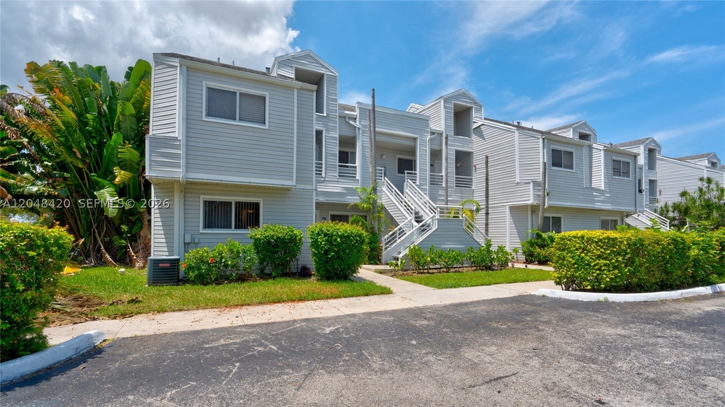 Photo of 3409 NW 44th St #101, Oakland Park, FL 33309 (MLS # A12048420)