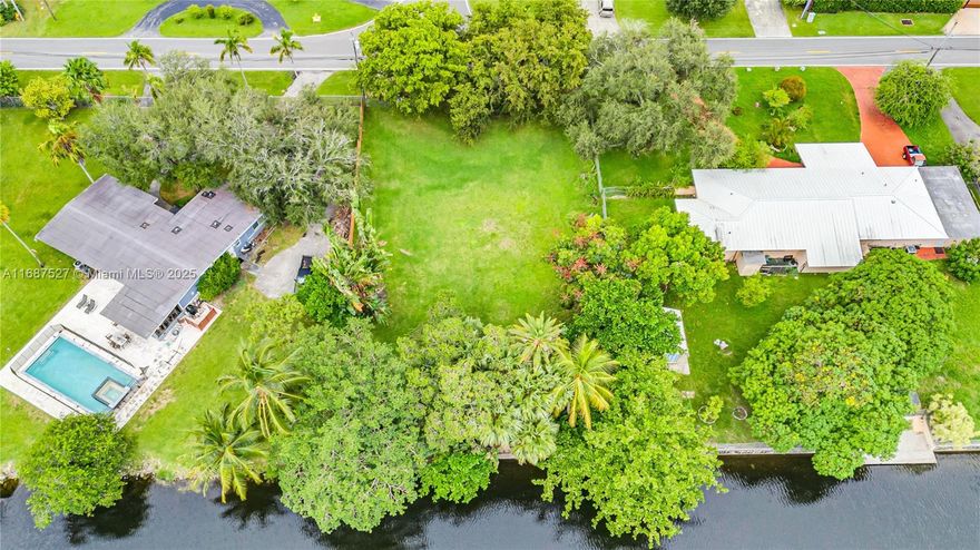 Incredible Value for 15,000+ SQFT of Prime Waterfront Land! Nestled between Biscayne Park and Miami Shores, and located minutes from Miami Country Day School, this property offers the perfect opportunity to build your dream home on a spacious 15,200 SQFT lot. The seawall is in excellent condition, the property is already elevated, and is complete with beautiful, mature trees on-site. Due to its location in Unincorporated Miami-Dade Country, the land offers a range of possibilities and flexibility for development, including the potential to be used as a short-term rental property. Inquire for more details!