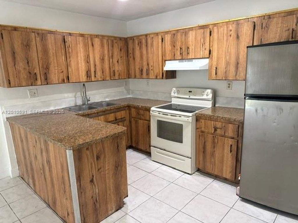 Photo of 10406 NW 36th St #10406, Coral Springs, FL 33065 (MLS # A12010591)