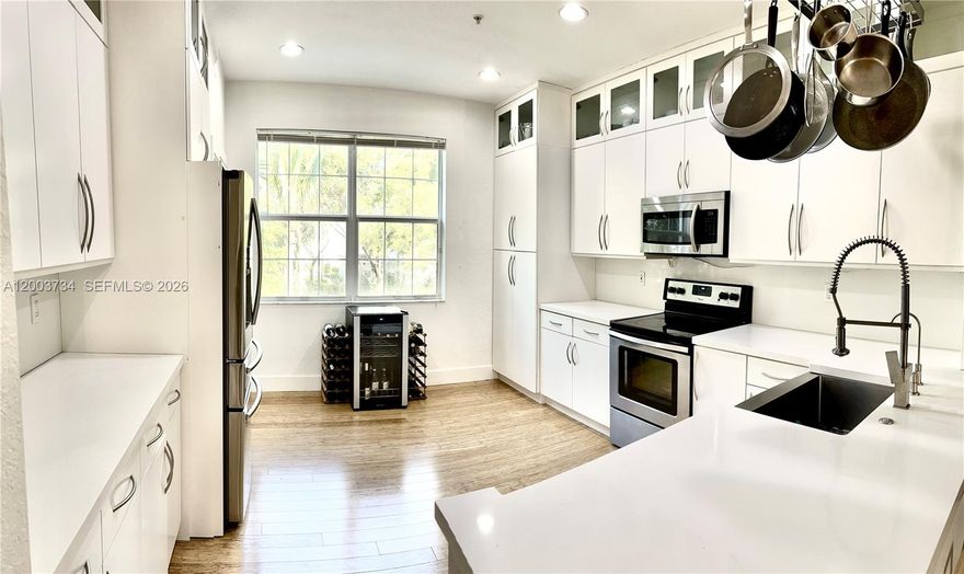 Welcome to your beautifully updated home featuring a spacious primary suite, a junior primary suite, and two additional half baths. The home showcases a modern kitchen, upgraded bathrooms, and stylish new flooring throughout. Enjoy a 2-car garage with a driveway accommodating two additional vehicles. This home offers peace of mind with impact windows and doors, LED lighting throughout, a whole-house water filtration system, and a new water heater. The downstairs includes a versatile loft-style room with its own half bath—offering the potential for a third bedroom on the ground floor.
Step outside your front door to a children’s park, and just steps away, enjoy scenic walks along the community path surrounding the lake. Residents enjoy a gated community with a clubhouse, fitness center, and resort-style pool, all in a prime location near highways, dining, and shopping.