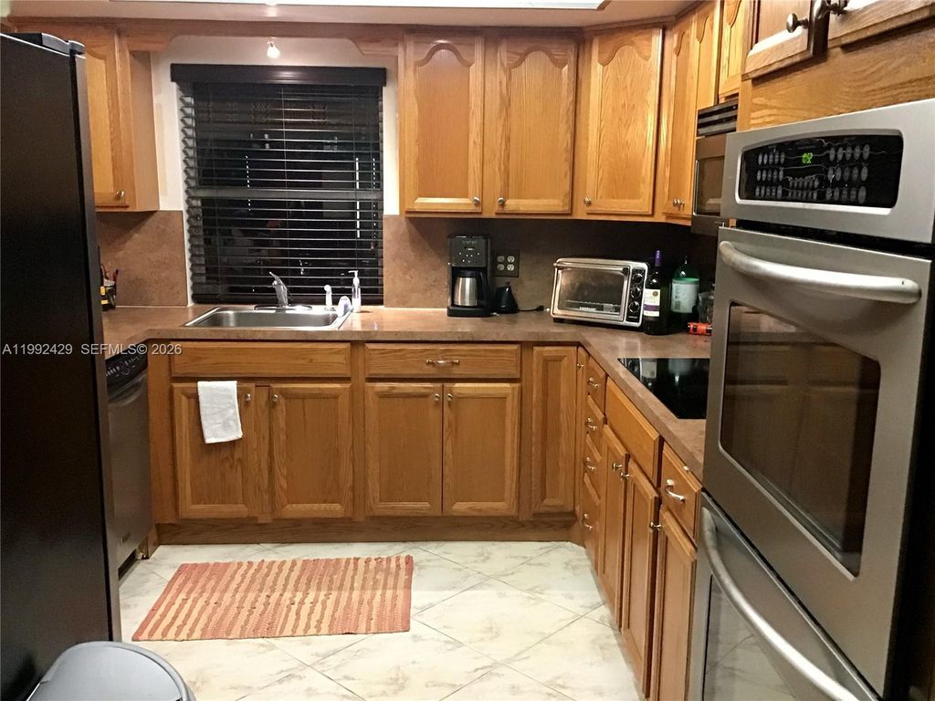 Photo of 3860 NW 5th Ct, Lauderhill, FL 33311 (MLS # A11992429)