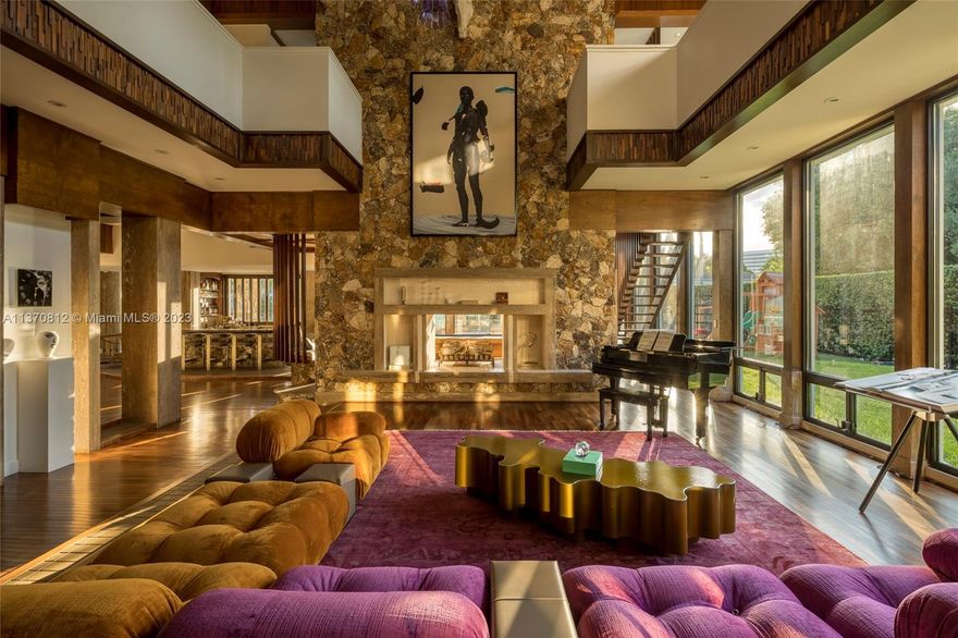 Located in the ultra-exclusive guard-gated community of Bay Point this waterfront architectural masterpiece of 10,414 square feet on a 15,599 square foot lot is reminiscent of Frank Lloyd Wright's legendary creations. With 30 foot high ceilings, walls of stone and a lush tropical entry lobby complete with floating staircase this estate is one-of-a-kind. With close proximity to exceptional dining and shopping the home features 6 bedrooms, 9 baths, a 94-foot private dock with direct access to the bay and ocean, chef's kitchen, discrete staff entrance, state-of-the-art spa, billiard room, outdoor kitchen, dual-sided full service bar for indoor/outdoor serving, luxurious pool and jacuzzi as well as a separate children's pool. This unique home is truly a private resort and an absolute must see.