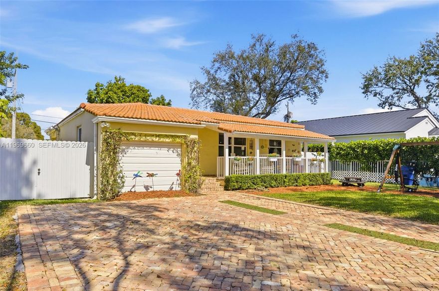 Beautifully updated and move-in ready, this 1,395 sq ft West Miami 3BR/2BA pool home blends modern upgrades with everyday comfort. A charming, shaded front porch welcomes you inside to an open living and dining area, seamlessly connected to a stylish kitchen with wood cabinetry, stainless-steel appliances, and granite countertops. French doors lead to a covered patio overlooking a sparkling pool and travertine pool deck —complete with a child-safety fence for peace of mind. Expanded primary suite with private bathroom and walk-in closet with custom closet cabinetry.  Including this permitted expanded primary suite, this home is 1,395 sq ft.  Recent upgrades to the home include impact windows, new AC, tankless water heater, updated electrical panel, LED recessed lighting, and a Chicago brick driveway with motorized gate. Perfectly located just steps from Somerset Gables Academy Charter School, A-rated Sylvania Heights Elementary, Cooper Park, a new Publix, and the West Miami Recreation Center—offering low-cost after-school and summer programs exclusively for West Miami residents. A truly turnkey home in a highly convenient, friendly neighborhood