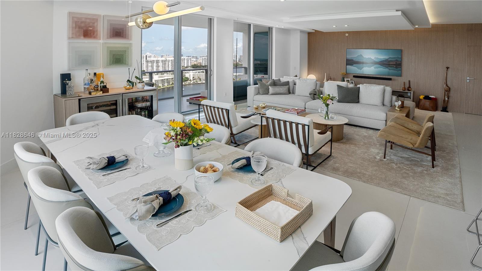 This immaculate luxury unit with 2 Bedrooms, a Den converted to a 3rd Bedroom, and 2.5 Bathrooms was professionally designed and decorated with imported Brazilian woodwork finishes. This Smart home greets you with minimalist doors and full automation – Audio, video, shades, lighting, and thermostat – via Control4. It offers high-end Sub-Zero/Wolf appliances, such as refrigerator, oven, microwave, coffee system, beverage center, and wine cooler (42 bottles dual-zone). This home was renovated for comfort, offering an upgraded laundry area with a utility sink and LG Smart Wash Tower, and two office setups with standing desks built in.