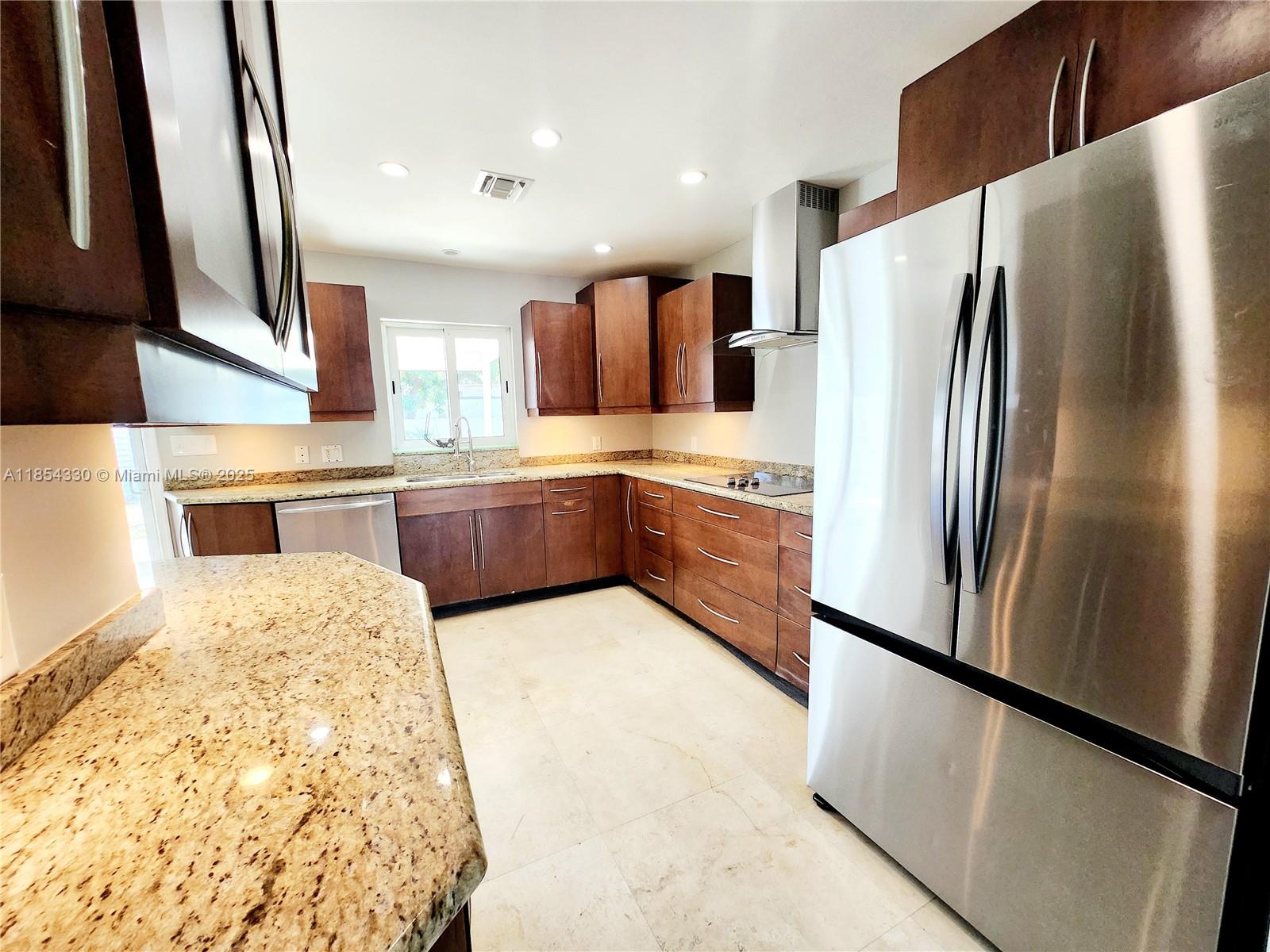 This beautifully updated 3-bedroom, 2-bathroom home offers both comfort and convenience. Step inside and be greeted by a bright and airy living space, perfect for relaxing and entertaining. Huge kitchen is equipped with everything you need, from sleek appliances to ample counter space. The bedrooms provide plenty of room for your family or guests. All impact windows and doors, front load washer and dryer, central AC, high-end marble flooring through out the house. large fenced yard!