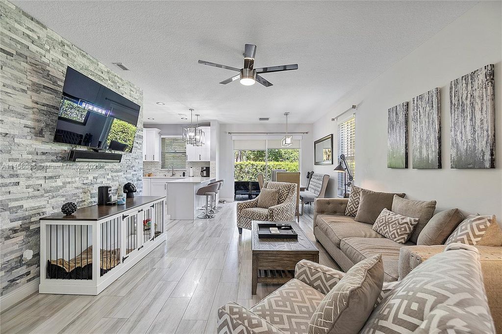 Photo of 6045 Seminole Gardens Cir, Riviera Beach, FL 33418 (MLS # A11456085)