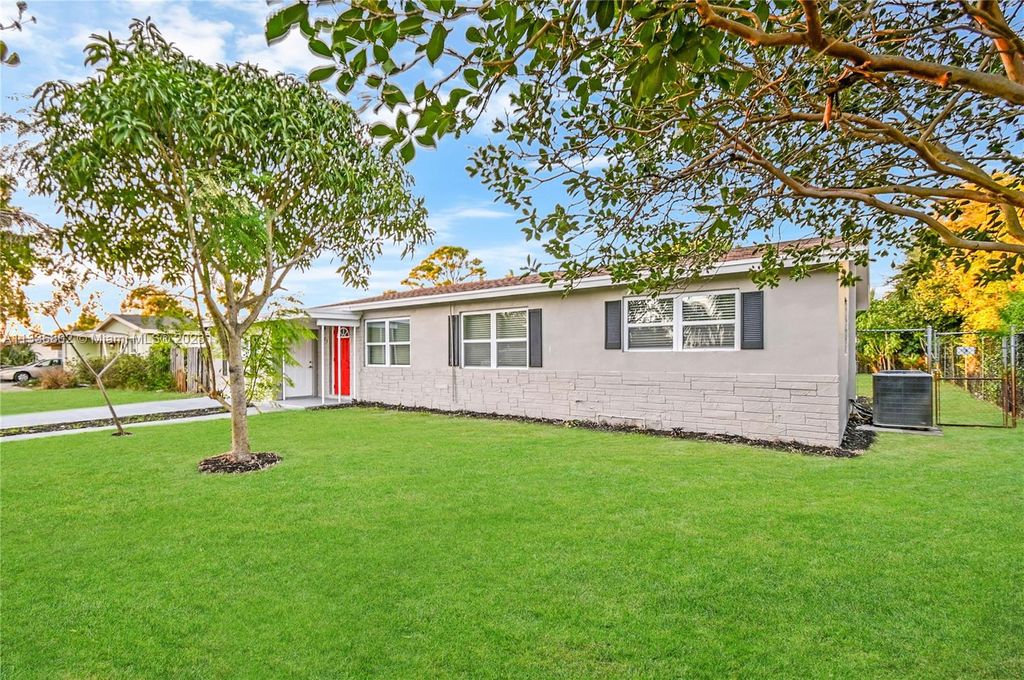 Photo of 823 Magnolia Dr, Lake Park, FL 33403 (MLS # A11336802)