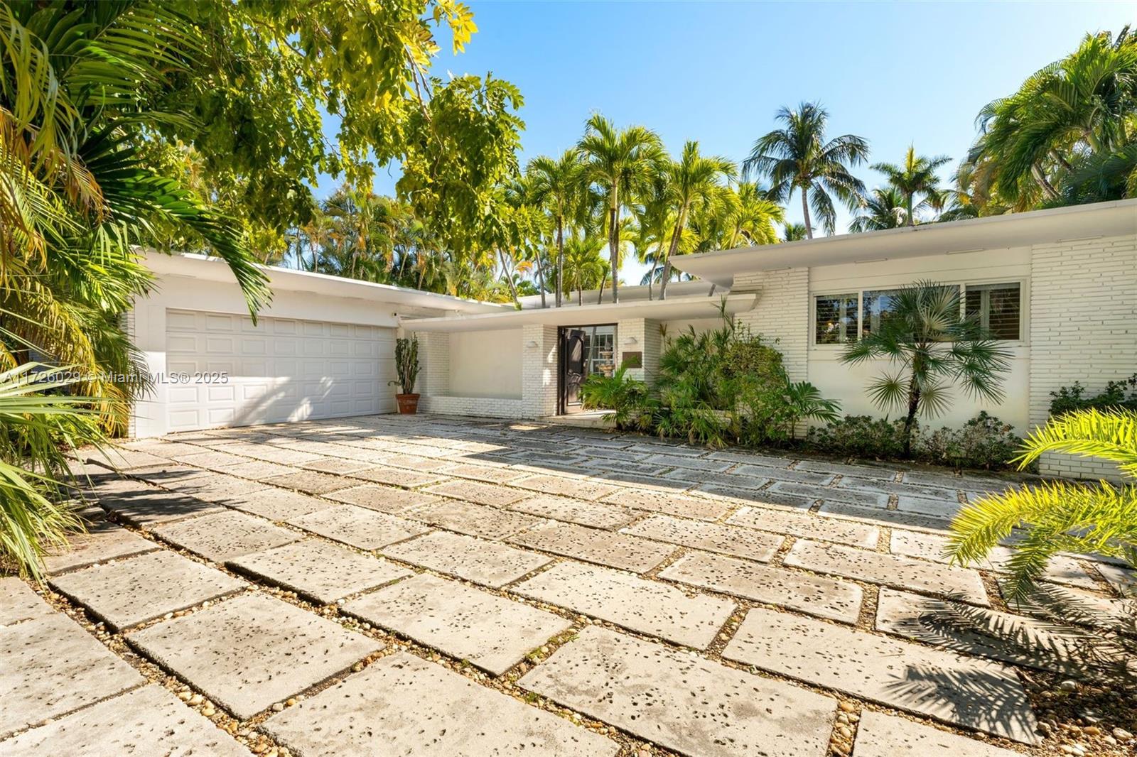 Exclusive opportunity to transform this corner-lot gem on sought-after Normandy Isles. Offering stunning bay views from sunrise to sunset, this 14,450 SF property features 85 feet of prime water frontage and the privacy of a desirable corner location. The 4-bedroom, 4-bathroom home spans 3,407 SF of interiors filled with abundant natural light, perfect for entertaining with its seamless indoor/outdoor layout. The exterior boasts a BBQ, heated pool, manicured garden patio, and private dock—a boater's dream. Enjoy the serene atmosphere while envisioning the possibilities this property holds. Build new or reimagine the current home to embody Miami Beach’s luxurious coastal lifestyle, just minutes from top dining and entertainment near South Beach, Bal Harbour, and Normandy Shores Golf Club.