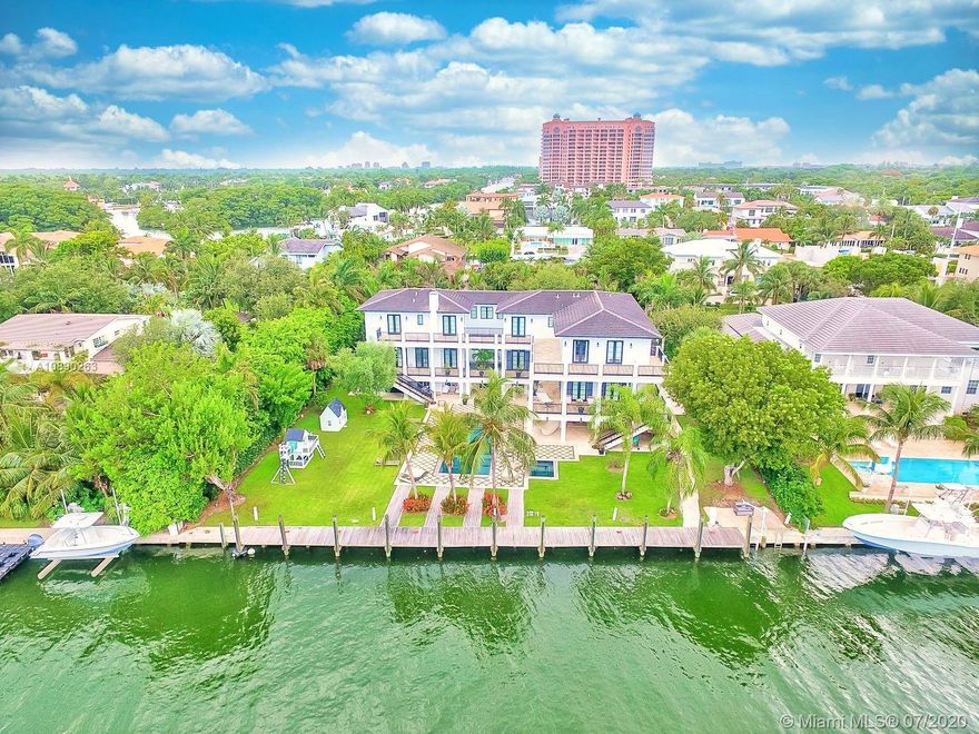 Beautiful and majestic mansion on an over-sized lot with 150ft water frontage that makes it a unique and desirable home. Located in the prestigious guard gated community in Sunrise Harbour on the Bay, one of the best hidden neighborhoods in Coral Gables. Amazing layout filled with natural bright light and elegant details. This spectacular home is made for entertainment, ample terraces through the house to enjoy the water views, no bridges to the bay, wide canal, boat dock, barbecue & summer kitchen by the gorgeous pool. Multiple living areas to accommodate a large family with 9 bedrooms and 9.5 baths, gym room, play/ bar room, elevator, gourmet white marble kitchen. Fabulous lifestyle in this spectacular move-in ready home near elite schools Coconut Grove, Downtown, Coral Gables & more!