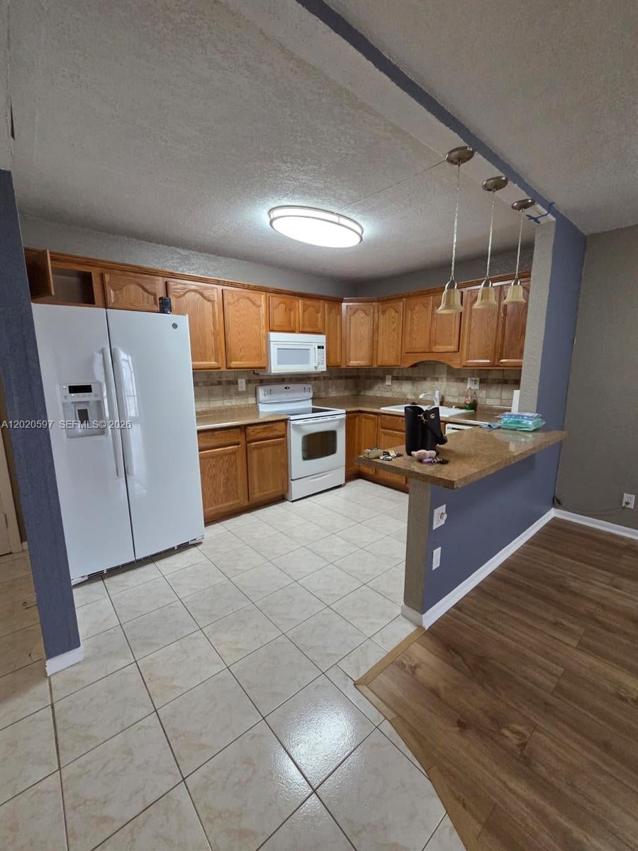 Photo of 4133 NW 88th Ave #102, Coral Springs, FL 33065 (MLS # A12020597)