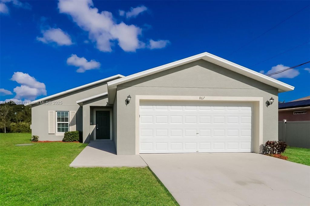 Photo of 867 SW Trouville Ave, Port Saint Lucie, FL 34953 (MLS # A11736363)