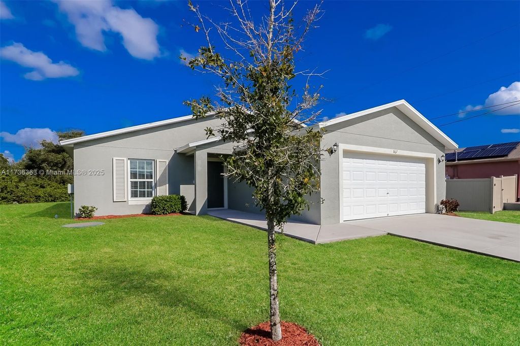 Photo of 867 SW Trouville Ave, Port Saint Lucie, FL 34953 (MLS # A11736363)