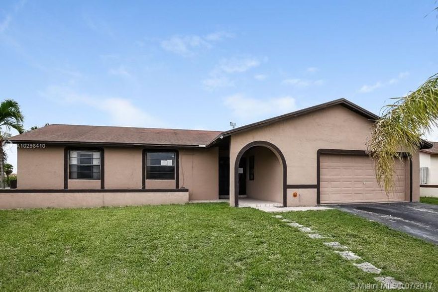 Spacious ranch style home with attached garage. Home features 4 bedrooms and 2.5 bathrooms. Great open floor plan with tile throughout.  Large eat in kitchen has ample cabinet and counter space.  Fenced yard with a partially covered patio.  Built in 1990, this home may require some enhancements and upgrades to  meet your needs.