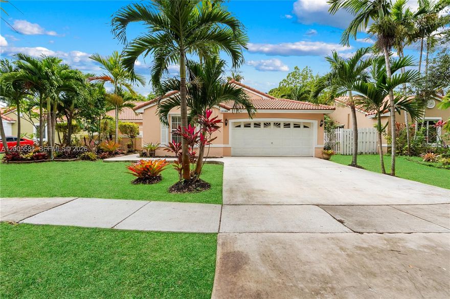 Welcome to this beautifully maintained 4-bedroom, 2-bathroom home with a 2-car garage in the sought-after Trilogy community of Miramar. Designed with a split floor plan and open-concept living, this home is filled with natural light and ideal for both everyday living and entertaining. The modern kitchen features solid wood cabinetry, granite countertops, stainless steel appliances (2023), and a center island for gathering. Enjoy a spacious primary suite with a walk-in closet and private bath. The fenced backyard is your own tropical retreat with mango, coconut, and Nesberry trees—perfect for outdoor enjoyment. Major updates include HVAC (2021), kitchen renovation (2023), impact front door, and a 12-year-old roof. Prime location near I-75, Turnpike, and I-95.