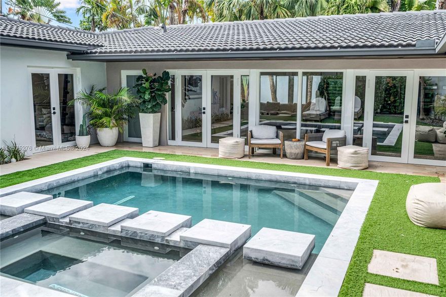 Charming and elegant one-story home on a corner lot of a beautiful cul-de-sac in prime location of Coconut Grove. Lush tropical landscaping all around the property, a lot of natural light gives the feel of the private oasis, steps away from the Bay. The house has a Bali/Tulum feel, complete with a heated pool and great outdoor space and open concept floor-plan ideal for entertaining. The home has been fully renovated- limestone flooring throughout, gorgeous black-stone granite kitchen countertops, renovated bathrooms, built-in custom closets, separate laundry room and a 2-car garage. Steps away from Grove Isle, walking distance to Bayfront parks, marina, cafes, restaurants, all the chic shops Coconut Grove has to offer. Property is Turn-Key, and ready for you to call home.