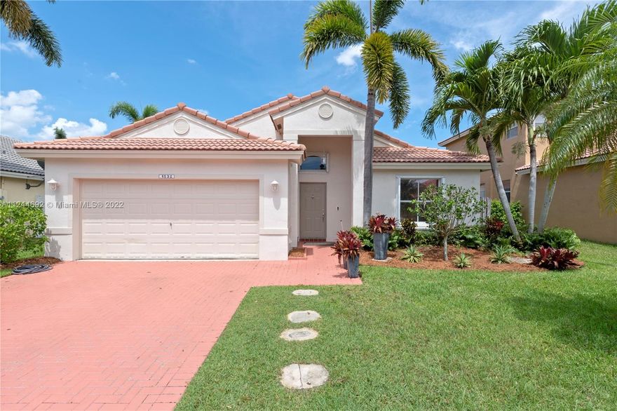 Welcome home to the beautiful community of Encantada. This home features a 3 bedroom split floor plan and 2 bathrooms. Neutral tile throughout and a freshly painted interior in a neutral color. The kitchen has stainless steel appliances. Relax in the landscaped private backyard on the extended pavered patio. Two car garage with a pavered driveway. Accordion hurricane shutters. AC 2018. Water Heater 2017. 24hour guard gated community. Amenities include a community pool, playground and tennis courts. Close to schools, shopping, restaurants, parks and more.