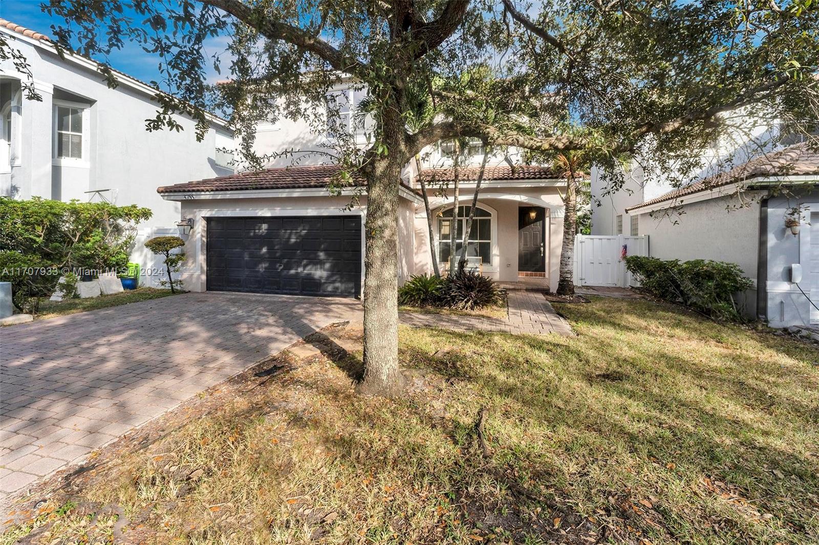 Welcome to the beautifully maintained Mapleridge neighborhood, just minutes from the beaches, airport, houses of worship & so much more! After you pass thru the 24 hour guarded gate you'll see the community pool. Another enjoyable amenity is the large tot lot within walking distance from the home. This 2-story house features 3 bedrooms, 2.5 baths in addition to a loft area as you come upstairs. The kitchen and flooring are new. The air conditioned garage can be used as an extra room ... a playroom, home office, etc. There is also ample storage space. A/C system & water heater are approximately 5 yrs. old. The roof is original. Out back there's a storage shed that'll stay w/the property.