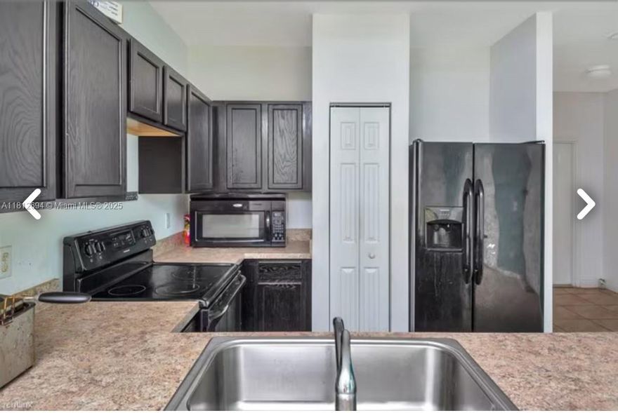 This townhome is a two-story residence with three bedrooms and an attached garage. overlooking pool! 3 bedrooms, 2.5 bathrooms, 1 car garage and driveway fit 2 cars. Built in 2017. Open kitchen with quartz countertops. Large master bedroom and walking closets in each bedroom. High ceiling. This home has been meticulously maintained. HOA FEES INCLUDES: cable TV, high-speed internet, landscaping, maintenance of the common areas, security patrol, management onsite, pool and clubhouse.  This beauty is located Near major highways (I-95 & Turnpike) and 441. Close to any shopping, dining, park, library and entertainment needs It features an open layout that seamlessly connects the living area, dining room, and kitchen to a covered terrace.