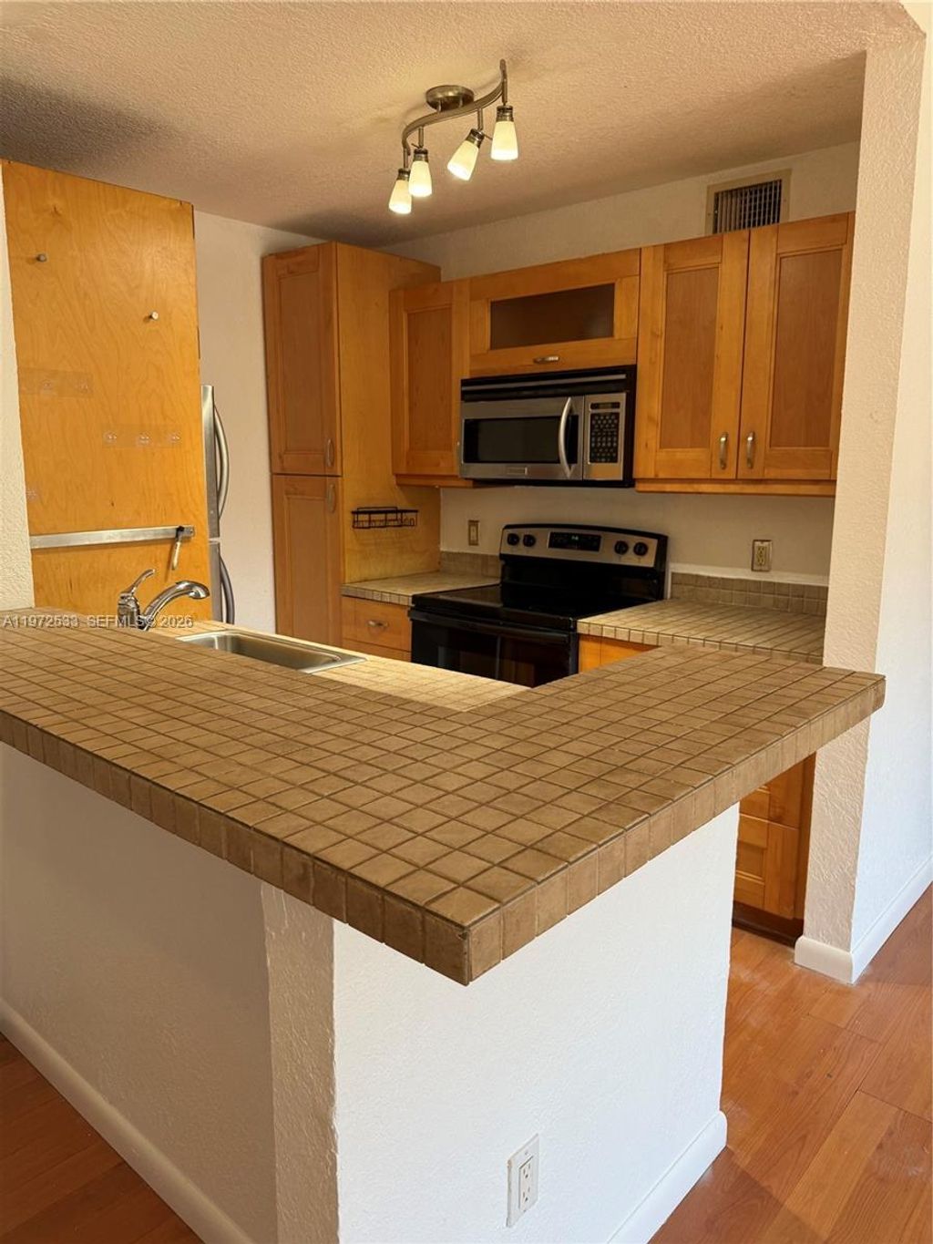 Photo of 4421 McNab Rd #19, Pompano Beach, FL 33069 (MLS # A11972533)