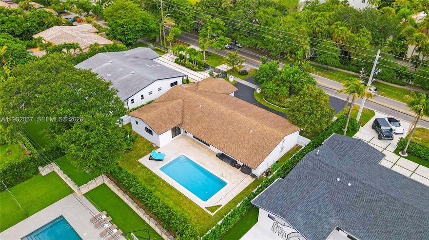 Elegant one-story residence in the prestigious Skylake Manors, offering refined living on an expansive lot. This beautifully appointed 4-bedroom, 3-bathroom home features a seamless layout with spacious living areas, formal dining, and a thoughtfully designed floor plan ideal for both everyday comfort and upscale entertaining.
The gourmet kitchen is equipped with gas appliances and flows effortlessly into the main living spaces, enhanced by natural light and sleek tile flooring throughout. The primary suite provides a private retreat with dual sinks and a separate tub and shower.
Step into your own resort-style backyard, complete with a sparkling pool, lush privacy fencing, and ample space for outdoor entertaining. A circular driveway and 2-car garage add convenience and curb appeal.
Built with durability and sophistication in mind, the home includes impact windows and doors, hurricane shutters, and quality construction throughout. With no HOA restrictions, this property offers both exclusivity and flexibility.
Ideally located near top schools, fine dining, and premier shopping, this is a rare opportunity to own a distinguished home in one of Miami’s most sought-after neighborhoods.