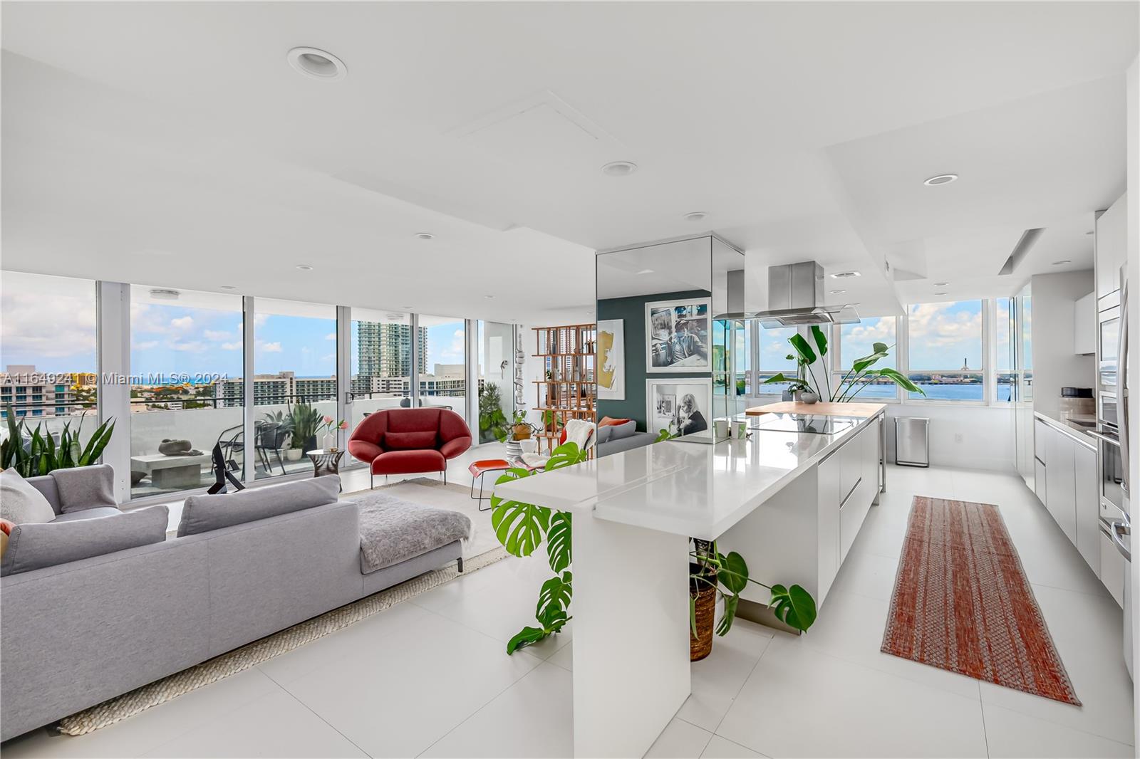 Impeccably renovated large corner unit with breathtaking bay and Miami Beach views from every room. Beautiful off white ceramic tiles in large format throughout. Open kitchen with sleek wood and corian counter tops. Spacious living and dining room. Ornare kitchen and closets throughout. Second bedroom open with sliding door for use also as family room or office space. Impact windows and balcony sliding door. Watch the sunrise everyday from every room and enjoy the views from the oversized balcony. Please call 24 hours in advance