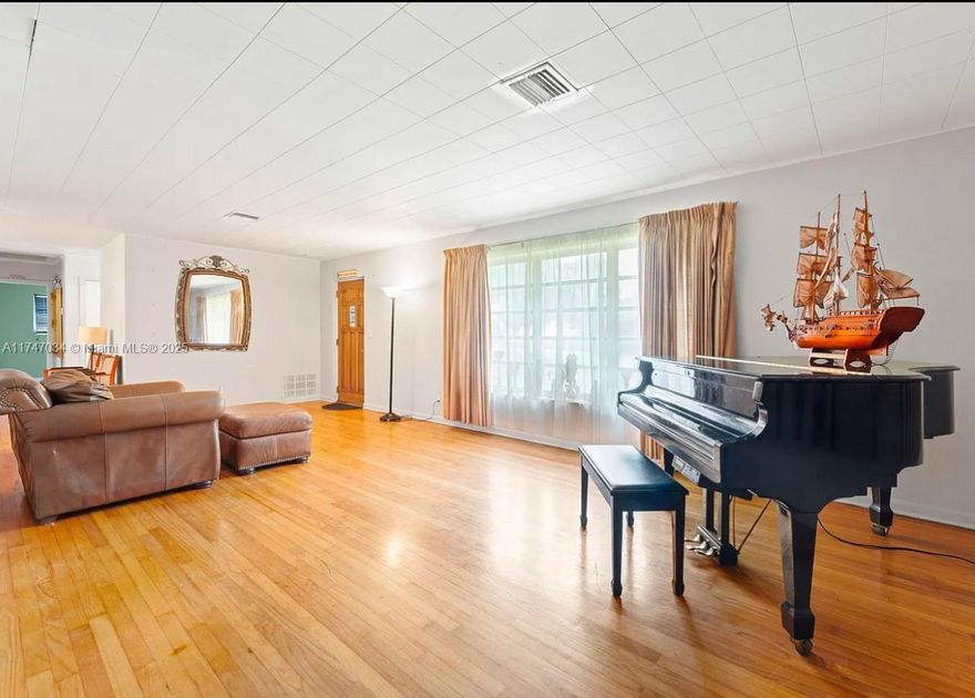 Spacious 4 bedroom, 3-bath home in a sought-after lakefront community! Features include a mother-in-law suite with kitchenette, a bonus room (perfect for an office, spa, or extra closet), and two master suites.  The home boasts beautiful natural wood floors, 2,463sf of updated living space, and two AC units.  Sitting on a huge 12,600 sf lot, there's plenty of room for a pool.  Neighboring homes have sold for $715k-$1.8M, making this a fire sale at $560K.  Perfect for families or investors seeking instant value.  Don't miss this rare opportunity! Schedule your showing today!