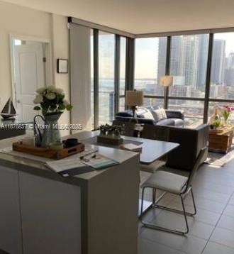 Beautiful corner unit on the 20th floor with clear view over the east coast, and the city. This apartment features a modern open layout, floor-to-ceiling windows, and natural light with stunning water and city views. The condo has 1018 SF, two bedrooms, two bathrooms, and a laundry area inside the apartment. The rent includes two parking spaces and one storage on the same 20th floor. Some features are: two pools, a jacuzzi on the rooftop, a sauna, a Gym, a pet washroom on floor 9th, a business center looking at the city, a game/social room, and a nice common kitchen and social area looking to one of the pools on the 9th floor. Perfectly located just minutes from Wynwood, the Design District, and Downtown Miami, the ideal blend of luxury, convenience, and vibrant city living.