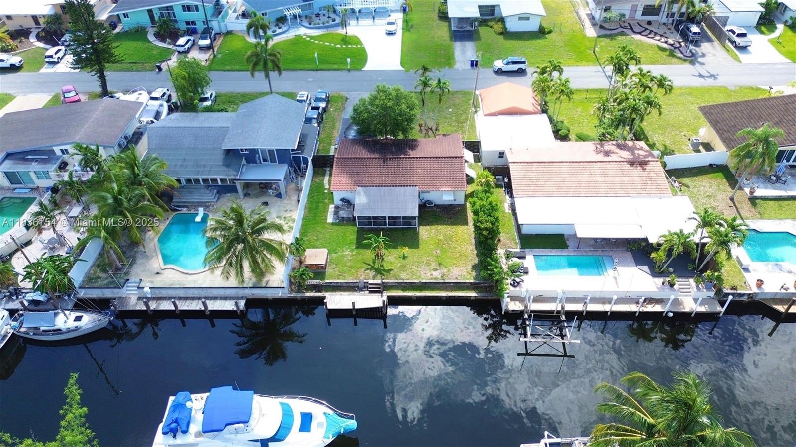 Stunning and Cozy Waterfront Home with Ocean Access & Private Dock! Live the South Florida dream in this fully renovated 2BR/2BA home with direct ocean access and no fixed bridges. Includes a private dock for boats up to 65', upgraded kitchen with stainless steel appliances, sunroom, open-concept living/dining, hot tub, laundry/storage room, Alkaline water filter, and carport. Enjoy the beautifully landscaped yard, perfect for relaxing or entertaining. Just minutes from beaches, FFL airport, downtown Fort Lauderdale, Hard Rock Casino, top-rated schools, and major highways. Short-Term Leases Available!. A rare waterfront gem—don’t miss it!