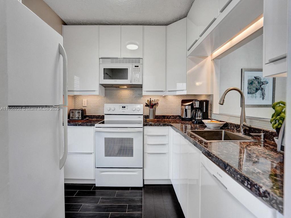 Beautiful unit for sale in Hawaiian Gardens Phase 4 in the Elderberry Building with 2 bedrooms & 2 bathrooms. Bright & immaculate with beautiful views on the lakes and on the game area. Remodeled kitchen with a large opening, modern white cabinets & granite countertop and high end appliances. Also, both Bathroom are remodeled completely with a contemporary style. Tile floor throughout the entire unit. This one will sell all furnished and turnkey with everything you need. Wow! New electrical panel & new roof. Hopa verified community with lots of activities, heated pool, shuffleboard, bacci, dards and more. Walk around the lakes, enjoy the bbq grills & more. Internet is included in the maintenance fees, Beautiful!