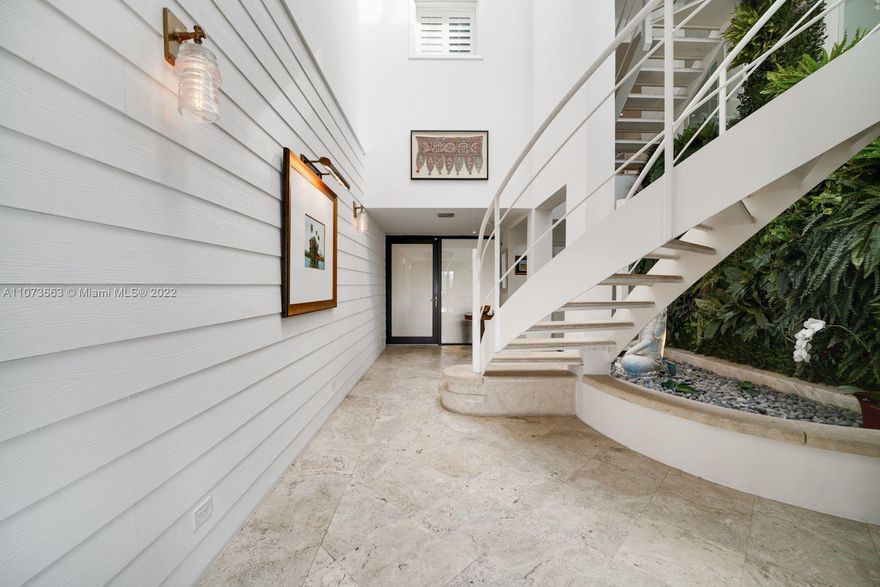 Chic and sexy 3-story TH + 2 roof decks and panoramic bay views of entire Miami skyline! Elegantly appointed, 3,890 SF with grand 35-ft sky-lit foyer that brings an abundance of natural light to each level. Roof decks feature built-in entertainment seating and grilling/bar. Party kitchen w/ Thermador & Sub-Zero appliances, huge island, & cozy eat-in booth. Refined master suite with epic walk-in closet. Large grassy lawn allows you and Fido to step out of your unit and enjoy the outdoors with all the convenience of a private home. Elevator, 2-car garage, Tesla charging station. Iconic 1000 Venetian offers 2 pools, hot tub, gym, 24-hour security, clubhouse, tennis, basketball courts & dog park, all on the historic Venetian Isles. This rare find is uniquely suited for the discriminating few.