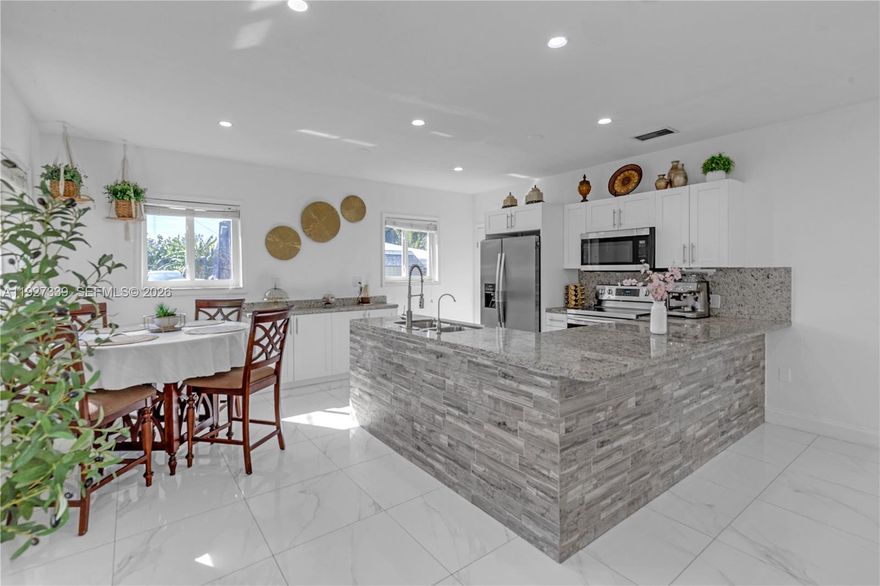 Discover this exceptional 5-bedroom, 5-bath estate located in highly desirable South Dade. Set on a beautifully maintained lot, this residence offers impact windows and doors, electric garage doors, and comprehensive security with an electric perimeter fence, automatic gate, and full aluminum fencing around the property. Enjoy added peace of mind with 3 new A/C units, 2 septic tanks, a full sprinkler system, and a whole-home water filtration system.


The outdoor spaces are truly impressive, featuring a covered terrace, electric front-porch shades, abundant yard space ideal for entertaining, and more than 23 mature fruit trees. A separate guest house provides flexible living options and includes its own office, making it perfect for work, visitors, or extended stays.