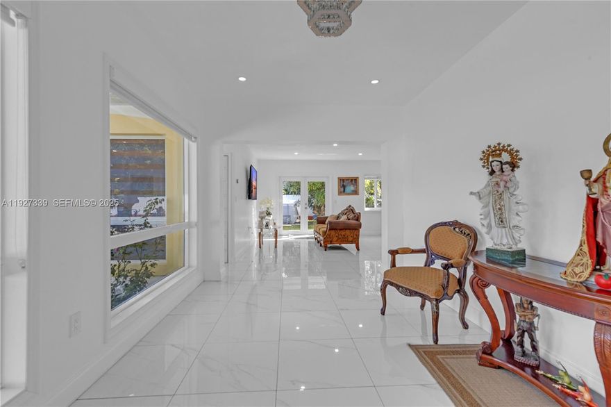 Discover this exceptional 5-bedroom, 5-bath estate located in highly desirable South Dade. Set on a beautifully maintained lot, this residence offers impact windows and doors, electric garage doors, and comprehensive security with an electric perimeter fence, automatic gate, and full aluminum fencing around the property. Enjoy added peace of mind with 3 new A/C units, 2 septic tanks, a full sprinkler system, and a whole-home water filtration system.


The outdoor spaces are truly impressive, featuring a covered terrace, electric front-porch shades, abundant yard space ideal for entertaining, and more than 23 mature fruit trees. A separate guest house provides flexible living options and includes its own office, making it perfect for work, visitors, or extended stays.