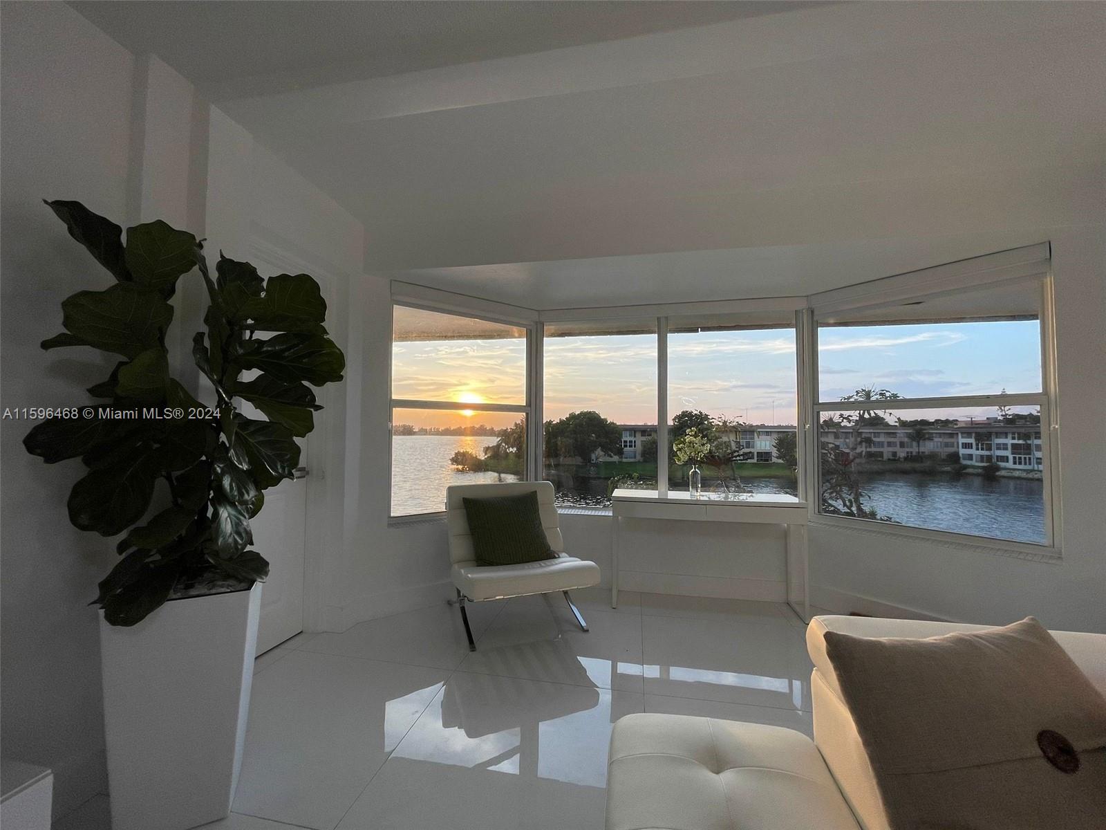 STUNNING completely and tastefully remodeled unit with an amazing water view. Open layout concept, eat in kitchen with an island, stainless steel appliances, Glossy, tall modern kitchen cabinets with quartz counter tops. Porcelain white floors throughtout the entire unit. Gorgeous chandeliers and modern fans. Plenty of closet spaces. The bathroom is fully tiled and has a modern shower with glassdoors. Impact windows with beautiful modern rolling shades. Master brdroom is huge with walk in closet. Laundry on site. Rent includes water. The building has 3 floors, elevator and is COMPLETELY GATED. Walking distance to shopping centers, Bus stop and 7 mins from Aventura mall.