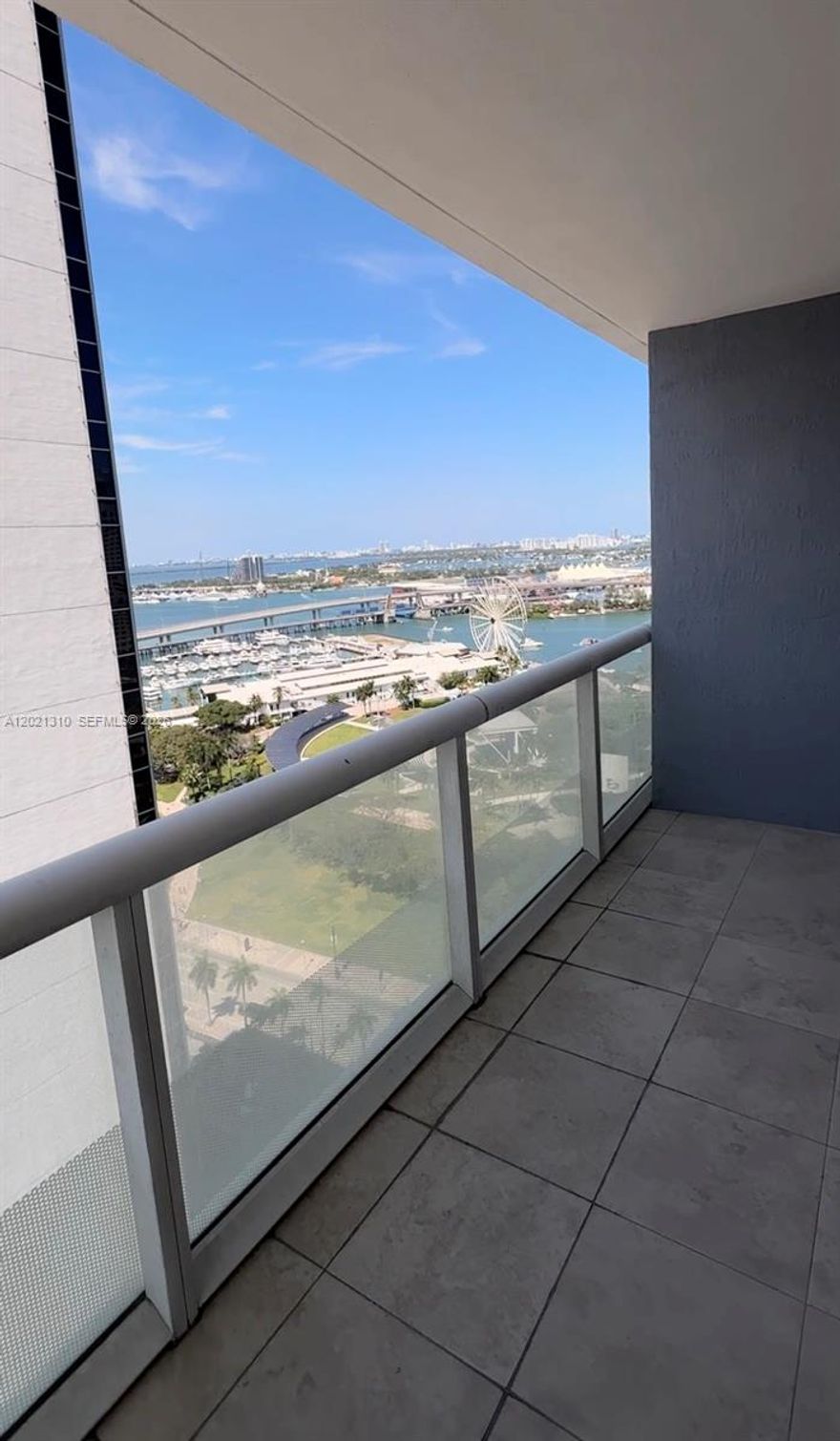 Corner unit, Wrap around balcony with bay views. White tile through out, remodeled kitchen. Perfect quiet spot even in the center of the city.