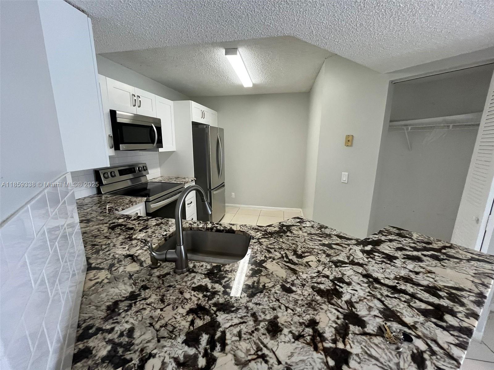 8821 Wiles Rd 203