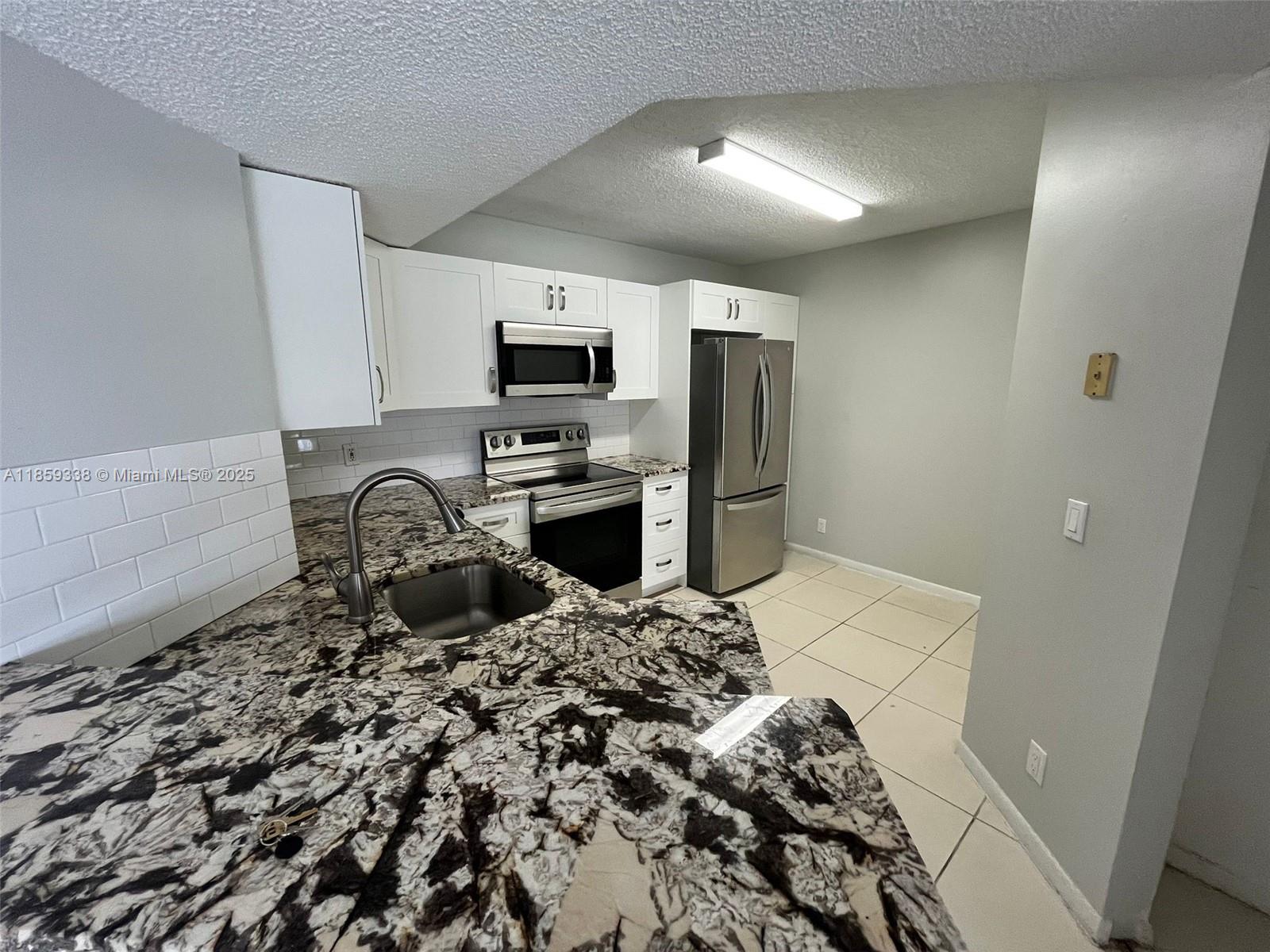 8821 Wiles Rd 203