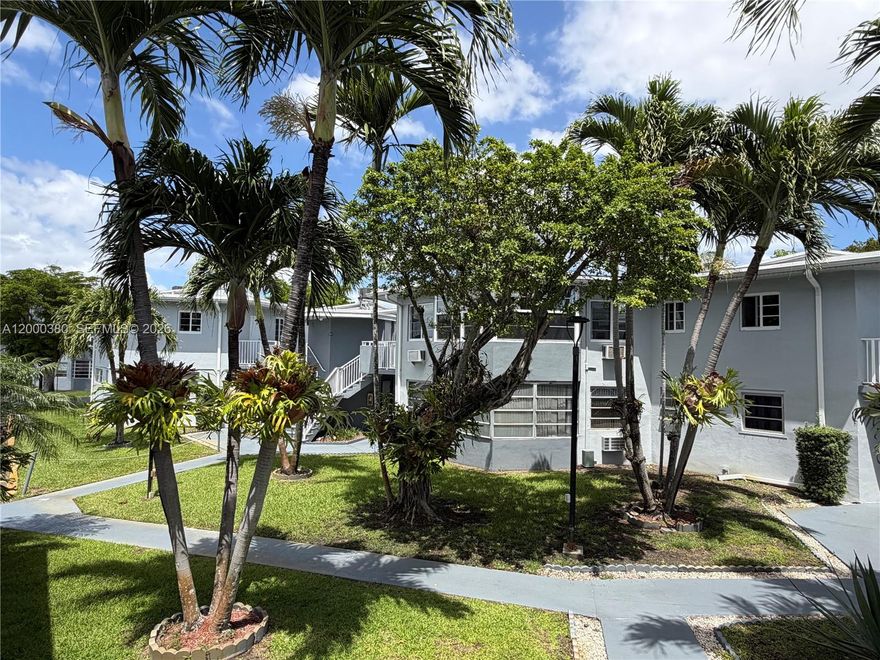 Spacious 1 bedroom + den townhouse-style residence on the ground floor in desirable Sky Lake Gardens. This bright unit features large windows, tile flooring throughout, and a generous open layout. The kitchen offers granite countertops and ample cabinetry. The bathroom includes a bathtub and window for natural light. Abundant closet space, and convenient on-site laundry just steps from your door. One assigned parking space included. Prime North Miami Beach location across from Sky Lake Mall, with quick access to I-95, Aventura Mall, shops, restaurants, parks, and beaches. Move-in ready and easy to show, don’t miss this opportunity!