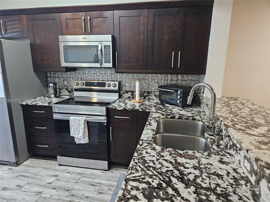 Warm and inviting two story townhome located in a private, walled community.  This move in ready home features two spacious bedrooms upstairs, each with its own full bathroom, plus a convenient half bath on the main level.  The kitchen offers newer appliances and a newer cabinetry, creating a fresh and functional space for every day living.

Ideally situated near beautiful areas beaches, shopping an douse of worship, the property is just minutes from Dania Beach, the Hollywood Broadwalk, Hard Rock Hotel & Casino, Dania Pointe, and Fort Lauderdale-Hollywood International Airport,. Miami international Airport is also easy accessible, approximately 45 minutes away.

The community is perfectly located, offering both comfort and convenience in of the area's most desirable settings.