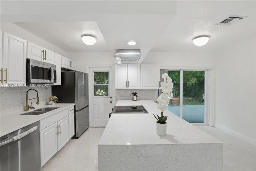 Beautifully remodeled 3-bedroom, 2-bath single-family home with approx. 1,384 sq ft of living area in Hollywood. Functional layout with an eat-in kitchen, living room, and family room. Versatile flex room offers great space for a home office, playroom, or hobby room. Brand-new kitchen featuring quartz countertops, new cabinets, and all new appliances, including stove, oven, refrigerator, dishwasher, microwave, and sink. Separate laundry room with new washer and dryer. Updated baths, new floors, and fresh interior and exterior paint. 2016 shingle roof, new A/C 2024. Fully fenced backyard with a shed, plenty of room for a pool. No HOA, no restrictions, park your boat or RV. Move-in ready and easy to show.