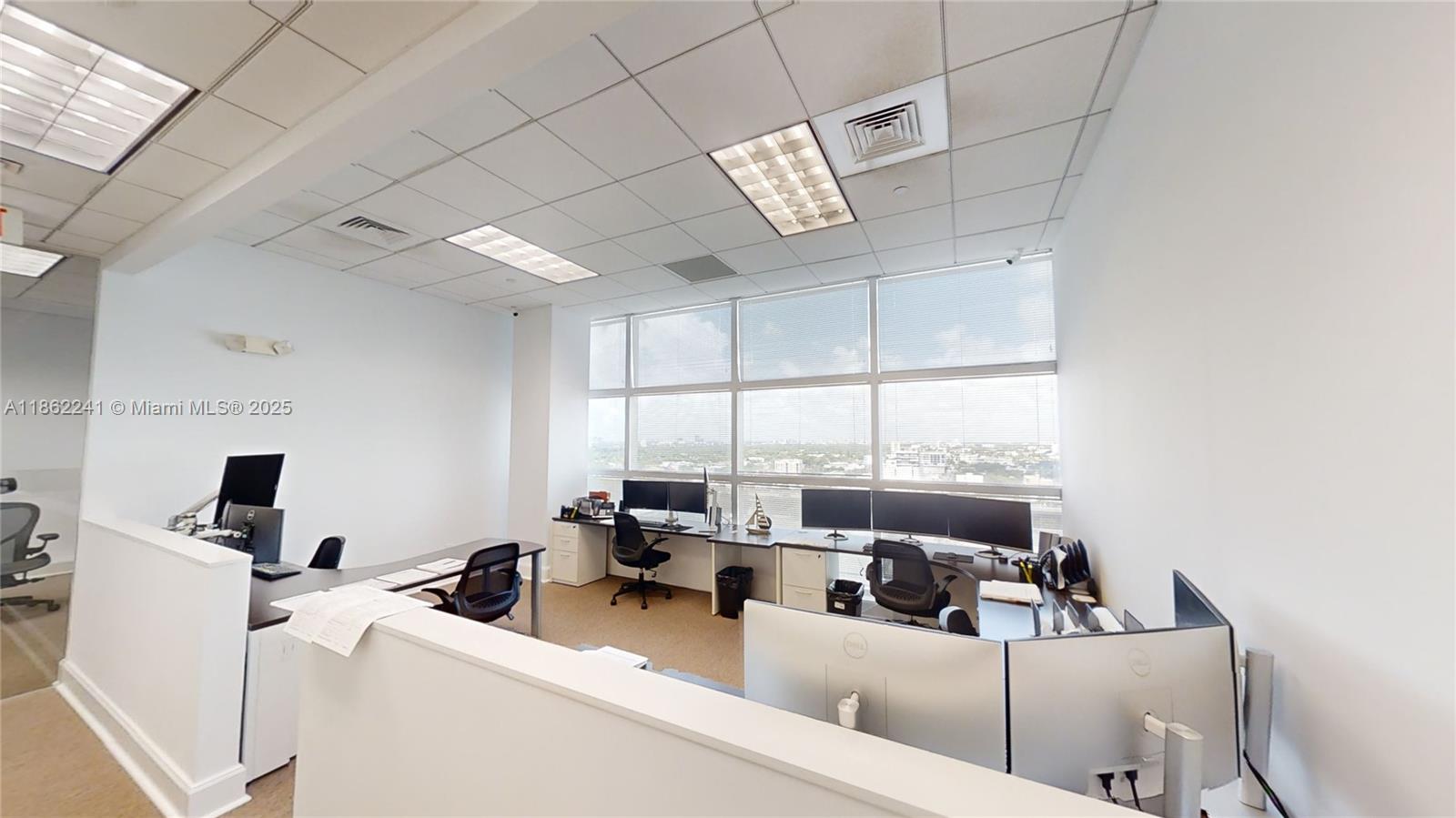 Corner Office Fully furnished 1472 sq ft SHARED SPACE of 2124 sq ft. with only two owner members. Up to 3 separate workstation areas included. One 25' x 12'-foot office area desk, One 20' x 19' Five-person workstation, One 8' x 10' reception desk. Plus, private lobby waiting room receptionist area, large conference room & storage/IT room & filing cabinets a rarely available private kitchen/lunch area. Perfect for professional financial services style office. Excellent location on the Miami Riverwalk path and on-site restaurants for visiting clientele. Guest parking and valet available for monthly rates.
